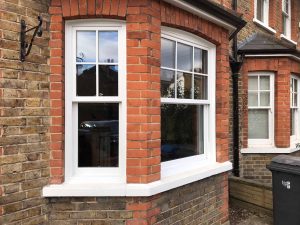 White sliding sash bay windows